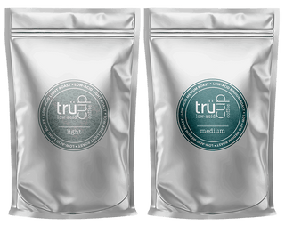 Low-acid coffee sample pack featuring trücup light and medium roast coffee bags.